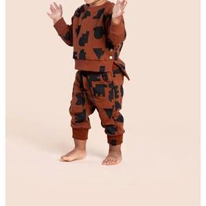 NEW OMAMIMINI terry joggers with print in rust